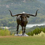 Mick Doellinger, Headin' North, Life-size Longhorn, bronze (ed. 5), 67 x 116 x 78.